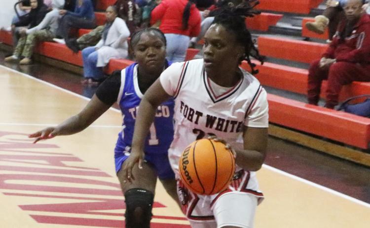 Fort White guard Zuri Hollie drives to the basket against Taylor County during the District 6-R championship on Feb. 6. (MORGAN MCMULLEN/Lake City Reporter)