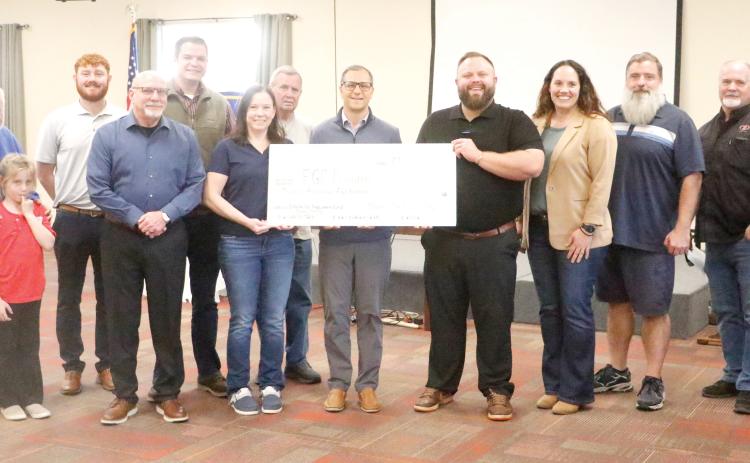Members of the Kiwanis Club of Lake City doanted $12,500 to the Foundation of Florida Gateway College on Tuesday to endow a career and technical education scholarship. The scholarship will be named in honor of Sandy Swilley, a longtime Kiwanis Club officer. (JAMIE WACHTER/Lake City Reporter)
