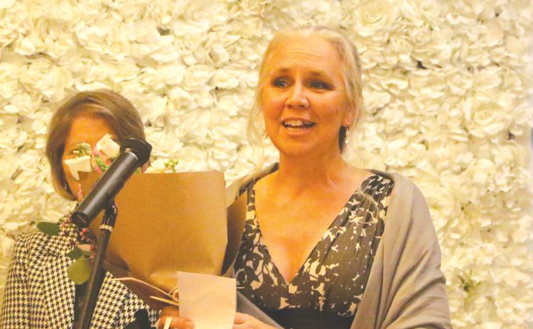 Suwannee Middle School math teacher Stacey Kibbe accepts the 2026 Suwannee County Teacher of the Year award Thursday. (MORGAN MCMULLEN/Lake City Reporter)