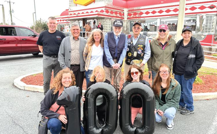 World War II veteran Edward McCarthy (back row, center) celebrated his 100th birthday with his family as well as other American Legion Post 57 vets and members of the Columbia County Sheriff’s Office. McCarthy is a retired corporal who served with the United States Marine Corps, earning both a Bronze Star and Purple Heart during his service. (COURTESY)