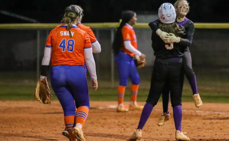 Columbia left fielder Addyson Sherman hugs first baseman Ava Christie (5) after hitting a walk-off single against Branford on Tuesday. (BRENT KUYKENDALL/Lake City Reporter)