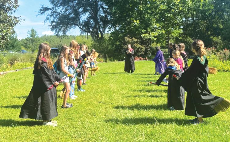 Participants in a previous Columbia County 4-H School of Life Skills for Magical Beings Day camp take part in an outdoor team challenge. Columbia County 4-H is set to host a wide variety of summer programs and camps, both practical and whimsical. (COURTESY)