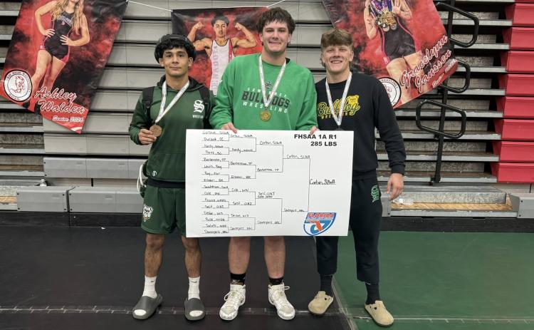 Suwannee wrestlers Rylan Milian (from left), Holden Corbin and Landon Slater qualified for state after reaching the medal stand at the Region 1-1A meet on Saturday. (COURTESY)