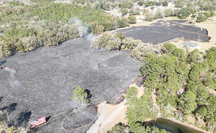 Columbia County Fire Rescue crews, along with the Lake City Fire Department and the Florida Forest Service, battled a brush fire in beween Sisters Welcome Road and Interstate 75 on Monday afternoon. The interstate was shut down temporarily due to poor visibility from the smoke. (ISAIAH CULLY/Special to the Reporter)