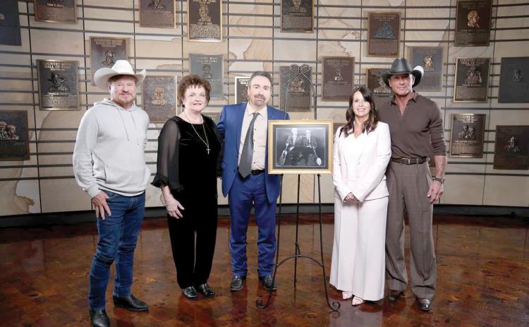 Lake City’s Jeanie Stanley Allinder (second from left), the daughter of Carter Stanley, is pictured with her cousins Ralph Stanley II and Lisa Stanley Marshall as their fathers, The Stanley Brothers, were inducted into the Country Music Hall of Fame on Friday alongside Tim McGraw (right) and Paul Overstreet. (COURTESY)
