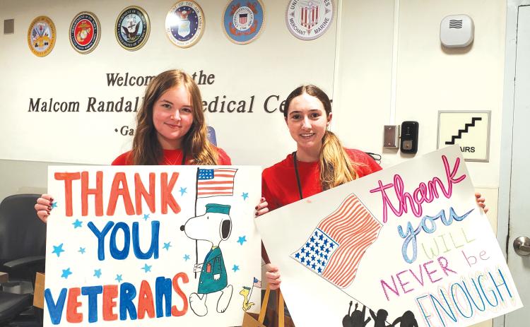 Youth volunteers show off thank-you signs supporting veterans. The Lake City VA Medical Center is currently looking for volunteers of all ages for various roles. (COURTESY)