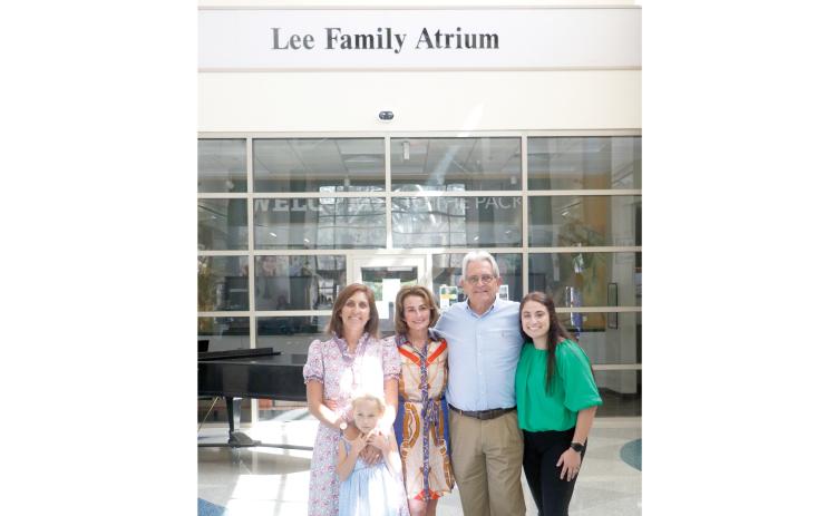 The Lee Family Atrium was dedicated in the Wilson S. Rivers Library at Florida Gateway College on Tuesday in honor of Mike and Missy Lee. The Lees are pictured with their daughters Jessica (left) and Meghan (right) and granddaughter Lettie. (JAMIE WACHTER/Lake City Reporter)