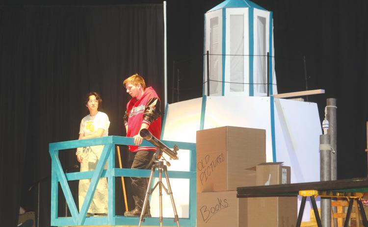 Megumi Boutwell (left) and Casey Dettman practice lines during a scene at a lighthouse for the Fort White High School production of Mystic Pizza. (TONY BRITT/Lake City Reporter)