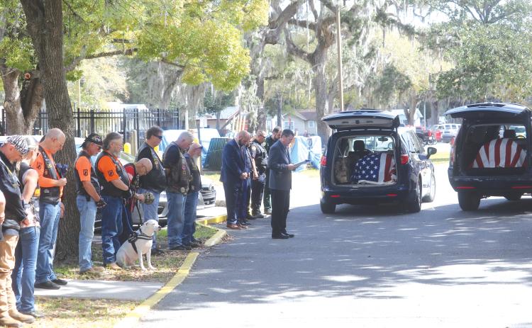 Members of the Lake City VA Medical Center, veterans and law enforcement honored a pair of veterans — Robert Zerby and Peter Daniels — during a Final Mile ceremony Thursday. (TONY BRITT/Lake City Reporter)