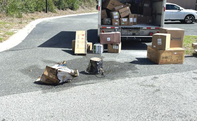 A smoking air fryer caused a brief fire in the back of a FedEx truck Friday morning. The fire was quickly doused after the driver removed the package from the truck. (COURTESY LAKE CITY FIRE DEPARTMENT)