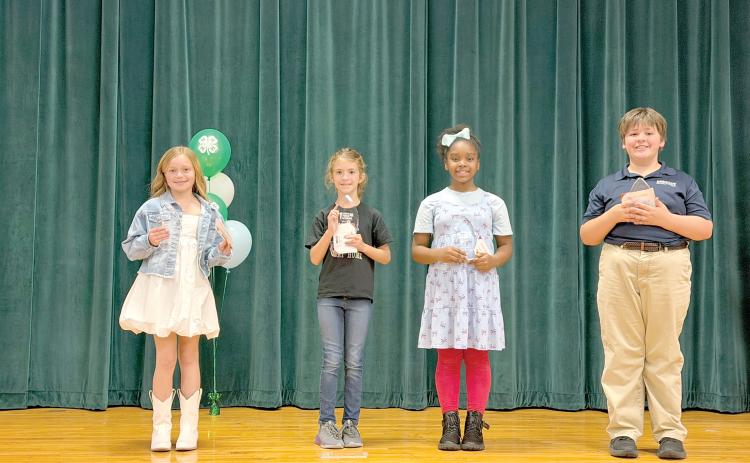 Fourth grade winners of the Columbia County 4-H Public Speaking County Contest pose with their awards. Winners were Charley Neeley of Westside Elementary, first place (from left); Teagyn Garcia of Fort White Elementary, second place; Ariella Mason of Columbia City Elementary, third place; and Eli McCray of Epiphany Catholic School, honorable mention. (COURTESY UF/IFAS EXTENSION COLUMBIA COUNTY)