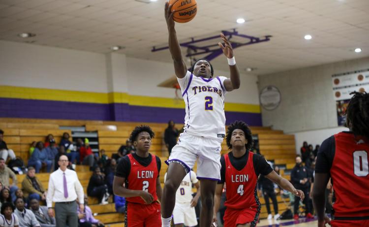 Columbia guard Kadrian Wilson rises for a bucket against Leon during the district semifinals this past season. The two teams won't be in the same district the next two seasons. (BRENT KUYKENDALL/Lake City Reporter)