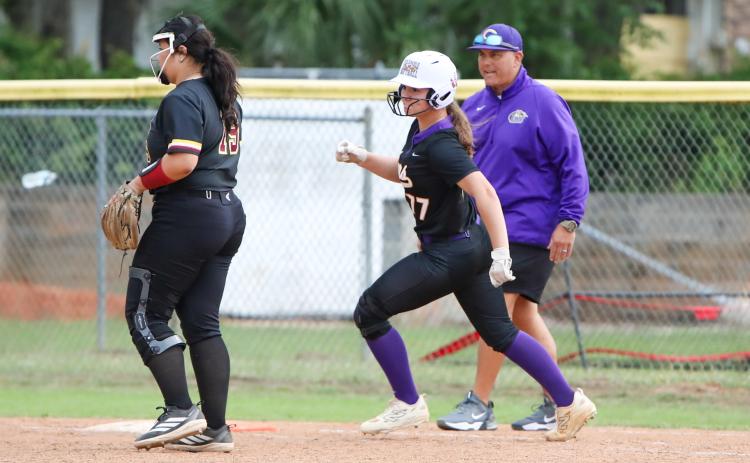 Columbia pitcher Ryleigh Stone rounds first base after hitting a single against West Nassau on Thursday. (BRENT KUYKENDALL/Lake City Reporter)