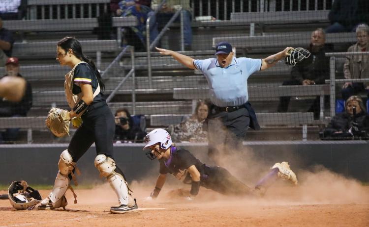 Columbia left fielder Addyson Sherman slides safely into home plate to score the game-winning run in the ninth inning of Thursday's 2-1 win against West Nassau. (BRENT KUYKENDALL/Lake City Reporter)