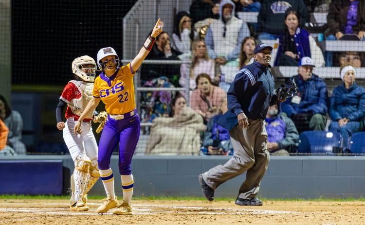 Columbia catcher Emily Delgado points to her home run as it flies over the fence during Tuesday's 13-2 win over Lafayette. (JACK HOWDESHELL/Lake City Reporter)