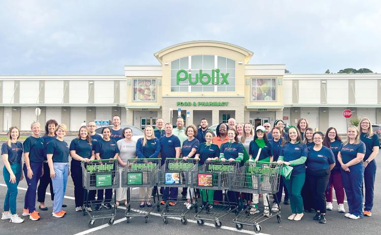 HCA Florida Lake City Hospital colleagues shopped for nonperishable food items to donate to Love INC. (COURTESY)