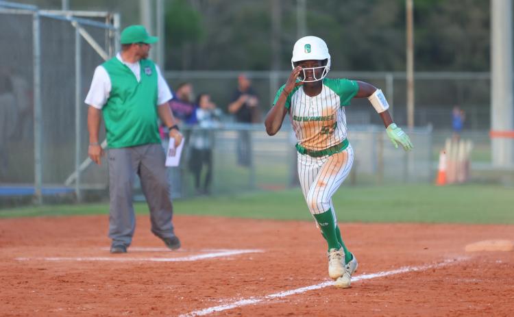 Suwannee outfielder Brianna Stephens-Woods races home to score a run against Branford on March 19. (PAUL BUCHANAN/Lake City Reporter)