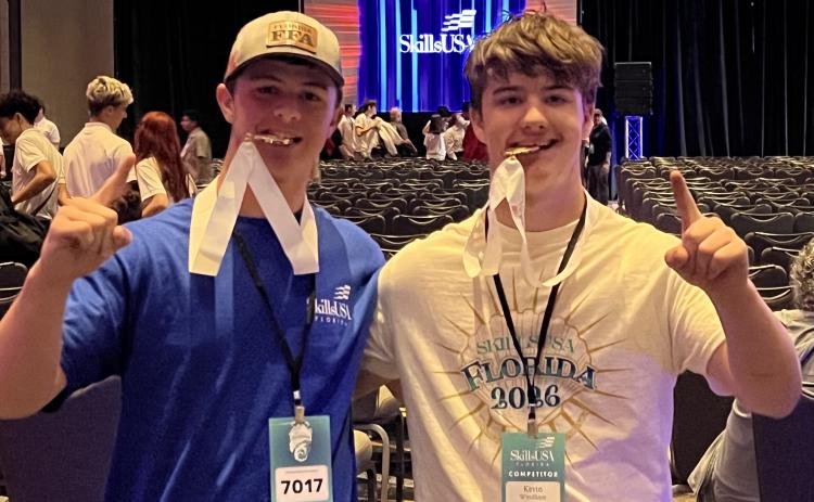 Columbia High’s Rylan Moses (left) and Kevin Windham won the SkillsUSA state competition gold medal for drones last week in Jacksonville. (COURTESY)