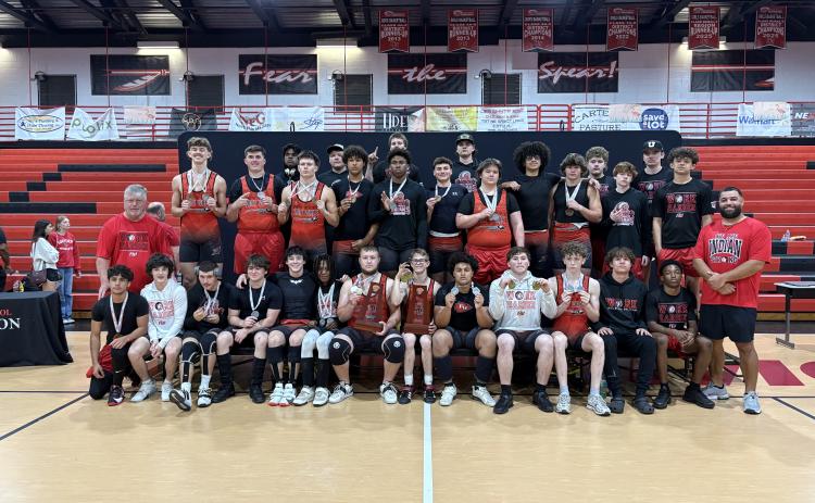 Fort White’s boys weightlifting team poses with the District 6-1A trophies on Wednesday. (COURTESY)