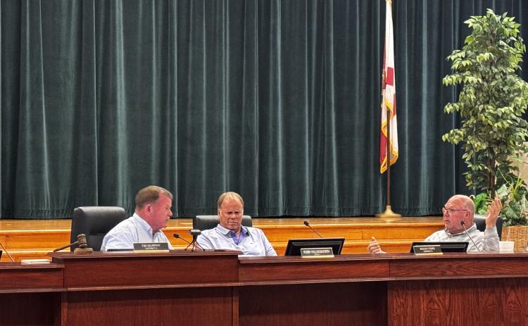 Columbia County Commission Chairman Tim Murphy (left) and Commissioner Rocky Ford (right) engage in a back-and-forth shouting match during Thursday’s meeting over the sale of the wastewater treatment plant at the North Florida Mega Industrial Park to the City of Lake City. (JAMIE WACHTER/Lake City Reporter)