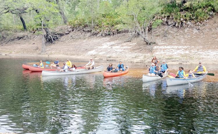 Teams get ready for the canoe race as part of Tri County Day on Saturday at Wayside Park in White Springs. (COURTESY)