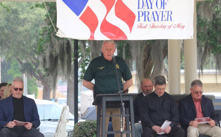 Columbia County Sheriff Wallace Kitchings recites the Lord’s Prayer at the National Day of Prayer observance in Olustee Park on Thursday. (TONY BRITT/Lake City Reporter)