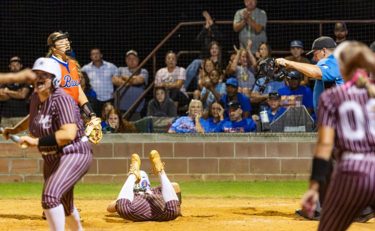 Branford pitcher Harleigh Price reacts at home plate after Madison County center fielder Ryleigh Bass scored the game-winning run on a wild pitch thrown by Price in the bottom of the ninth inning of Wednesday's Region 3-R final. (JACK HOWDESHELL/Lake City Reporter)