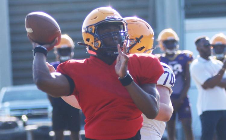 Former Columbia quarterback Xavier Collins throws a pass during spring practice on April 29. Collins departed after practice Tuesday to transfer to Camden County in Georgia. (JORDAN KROEGER/Lake City Reporter)
