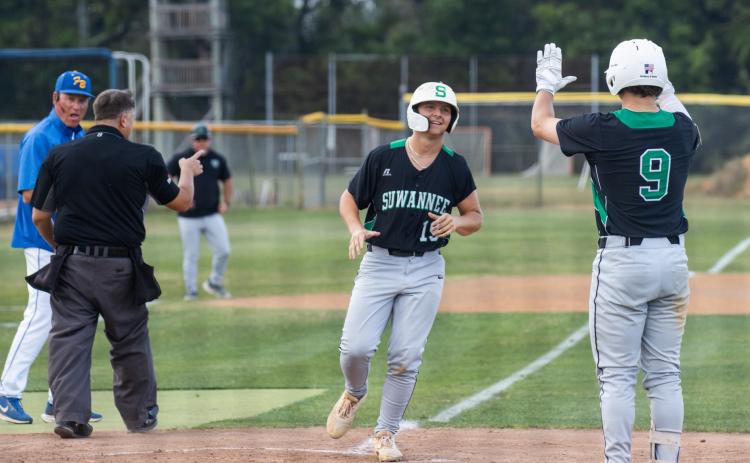 Suwannee first baseman Grayson Greene (19) is greeted at home plate by catcher Jace Moran (9) as he scores a run during Game 1 of the Region 1-3A semifinals on Friday. (ASHLEY CHANDLER/News-Leader)