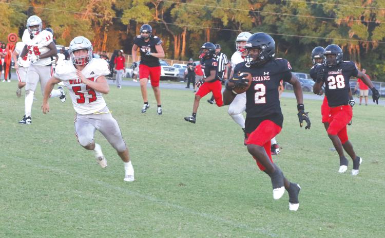 Fort White defensive back Marvion Wallace (2) takes his second interception of the night into Williston territory during Friday’s spring game. (MORGAN MCMULLEN/Lake City Reporter)