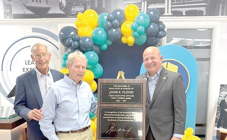 First Federal President and CEO John Medina (right) is joined by former First Federal CEO Keith Leibfried (left) and Johnny Flood, the son of previous CEO John Flood as the bank dedicated its main Live Oak branch to John Flood. (COURTESY)