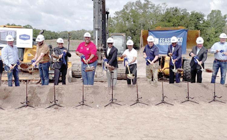 Nick Patel, Sen. Corey Simon as well as Suwannee County officials and representatives from Feasterco Construction, Florida Commerce, the City of Live Oak and First Federal Bank break ground on the new Hampton Inn & Suites in Live Oak. (JAMIE WACHTER/Lake City Reporter)