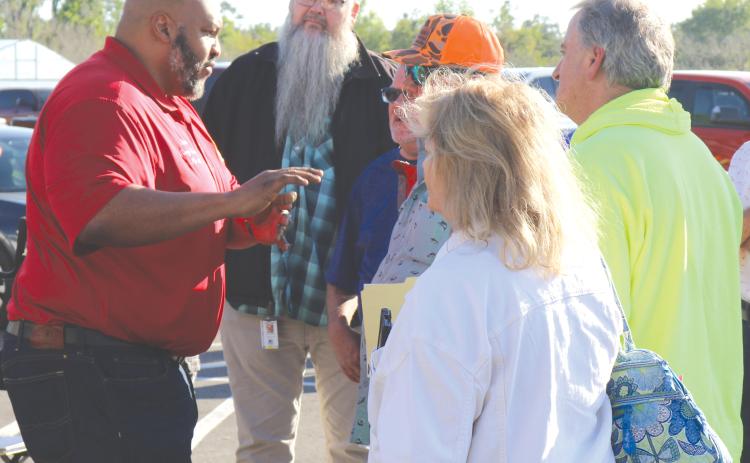 State Sen. Corey Simon (left) speaks with Water First North Florida meeting attendees outside the UF/IFAS North Florida Research and Education Center Suwannee Valley’s educational pavilion in March. (FILE)
