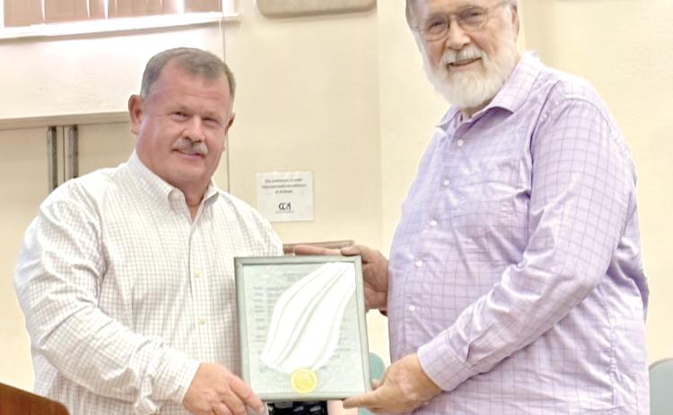 Columbia County Commission Chairman Tim Murphy (left) presents a proclamation declaring June 21-27 as Amateur Radio Week to Brad Swartz, the local Amateur Radio Emergency Services coordinator, at last week’s commission meeting. (COURTESY)