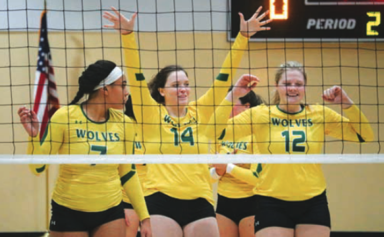 Former FGC volleyball players celebrate after a point in 2018. FGC said Friday that volleyball will return for the 2027 season after shutting down in 2021. (FILE)
