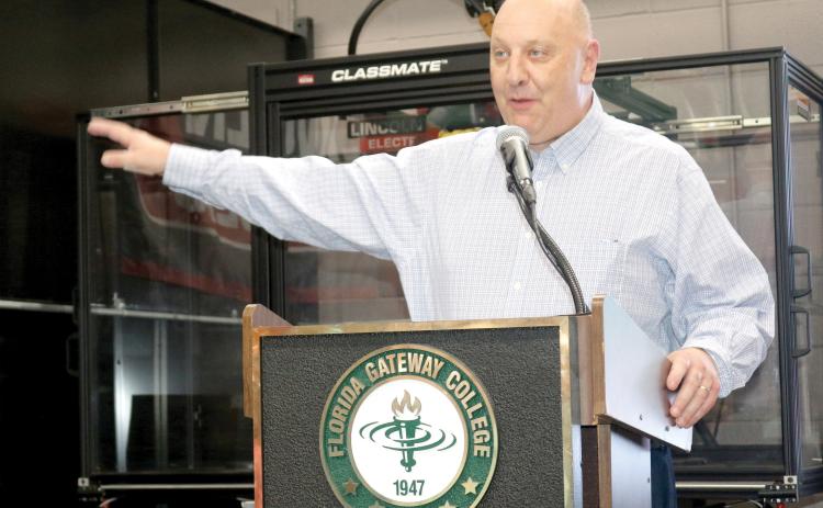 Florida Gateway College President Larry Barrett, speaking at the grand opening of the college’s renovated welding facility earlier this month, received a nearly perfect evaluation from the school’s Board of Trustees. (TONY BRITT/Lake City Reporter)