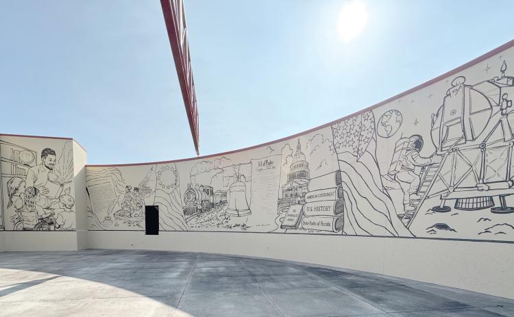The mural on the outside of the Columbia County Public Library’s West Branch that commemorates 250 years of American history. The mural, which still needs to be colorized, was funded by a state grant. (JAMIE WACHTER/Lake City Reporter)