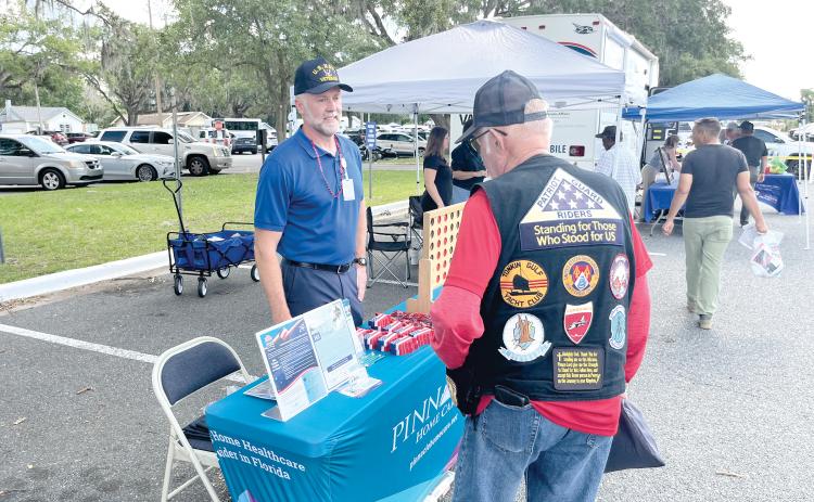 A veteran visits the Pinnacle Home Care table at last week’s Freedom 250 Veterans Fest at the Lake City VA Medical Center. (COURTESY)