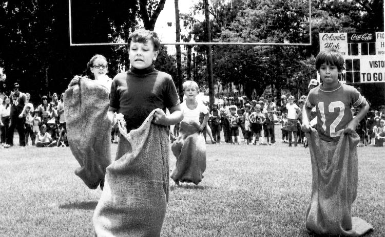Children take part in a sack race at Memorial Stadium as part of Columbia County and Lake City’s Bicentennial celebration in 1976. (FILE)