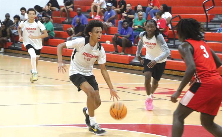 Fort White guard Tylan James drives to the basket against Williston during Tuesday’s summer league contest. (MORGAN  MCMULLEN/Lake City Reporter)