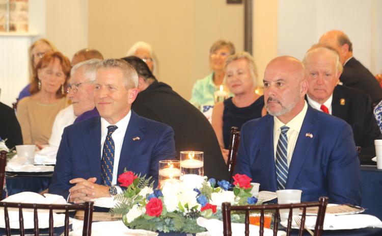 Former Florida Speaker of the House and gubernatorial candidate Paul Renner (left) and Chief Financial Officer Blaise Ingoglia listen during Thusday’s Lincoln/Reagan Dinner fundraiser. (TONY BRITT/Lake City Reporter)