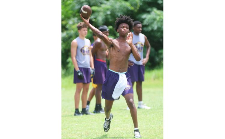 New Columbia quarterback Amari Green throws a pass in 7-on-7 drills during Monday’s summer workout. (JORDAN KROEGER/Lake City Reporter)
