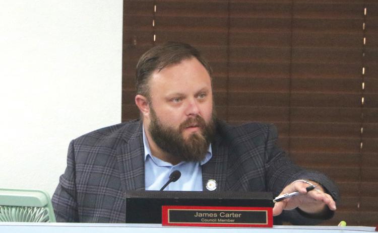 Lake City Councilman James Carter speaks during Monday’s council meeting. Carter recused himself from a vote on public benches due to his presidency with the Kiwanis Club of Lake City, which benefits through a grant program for the upkeep and maintenance of the benches. (MORGAN MCMULLEN/Lake City Reporter)