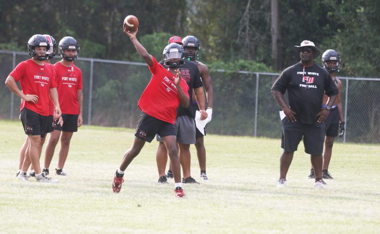 Fort White quarterback Chance Johnson throws a pass during Monday’s practice. (MORGAN MCMULLEN/Lake City Reporter)