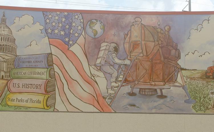 The mural by Cosby Hayes on the outside of the Columbia County Public Library’s West Branch detailing America’s history is now completed after Hayes added color to the various scenes from the past 250 years. (JAMIE WACHTER/Lake City Reporter)