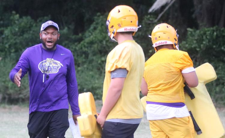Columbia offensive line coach Anthony Newton works with his offensive line during Monday’s practice. Newton has taken over for David May, who departed after just one spring in the job. (JORDAN KROEGER/Lake City Reporter)
