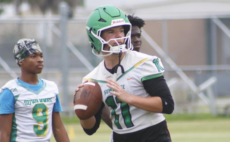 Suwannee quarterback Haigen Johnson drops back to pass during practice on Monday. (JAMIE WACHTER/Lake City Reporter)