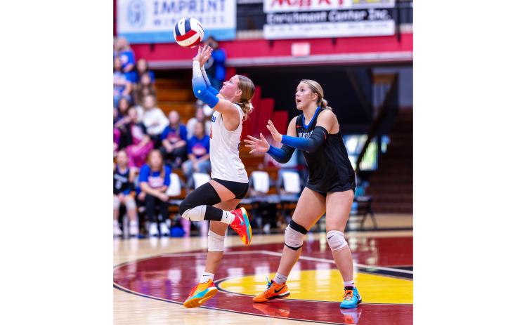 Branford libero Ava Alcorn (left) defends a shot while outside hitter Anabella Dicks looks on against Chipley during last season’s Class Rural state championship. Alcorn and Dicks are the only returning starters for the Buccaneers this season. (JACK HOWDESHELL/Lake City Reporter)