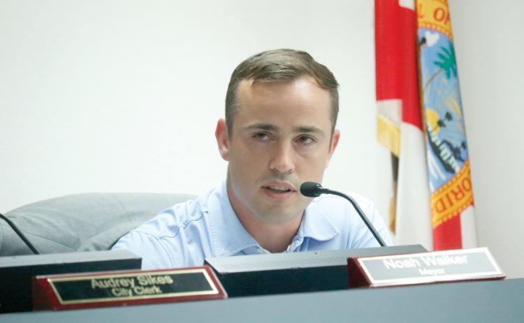 Lake City Mayor Noah Walker, shown in Monday’s council meeting, said during a budget workshop Tuesday that spending $13,000 on a parade float was a ‘crazy idea.’ (JAMIE WACHTER/Lake City Reporter)