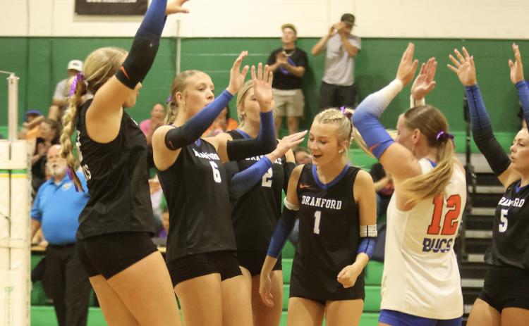 Branford players celebrate after a point against Suwannee on Tuesday. (PAUL BUCHANAN/Lake CityReporter)